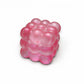 Mellow Monkey pink glittery bubble cube squeeze ball for stress relief and sensory fidget play.