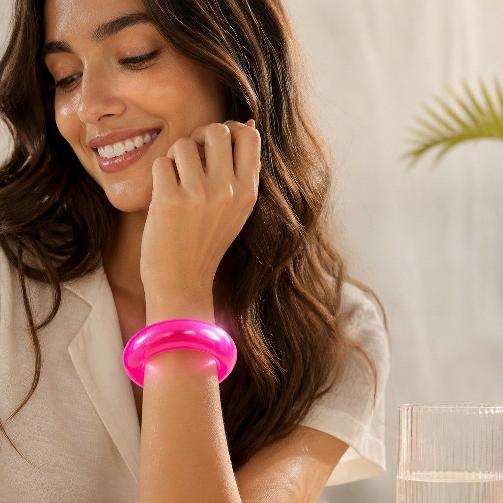 Mellow Monkey FEELZiES Jelly Donut Squishy wearable sensory fidget bracelet in bright pink on a woman's wrist
