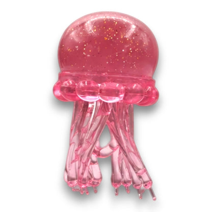 Mellow Monkey pink translucent octopus squish toy with glitter swirl finish for sensory stress relief.