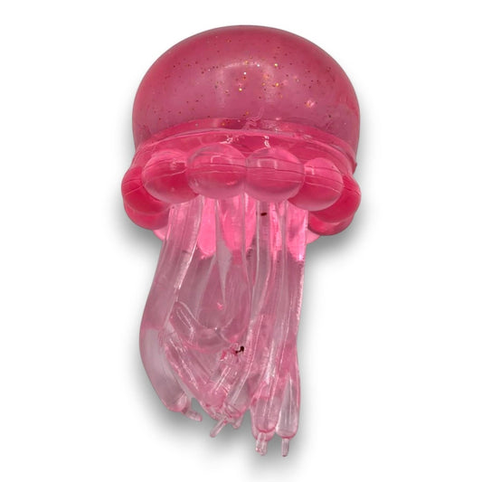 Mellow Monkey pink translucent glitter octopus squish toy for sensory fidget play and stress relief.