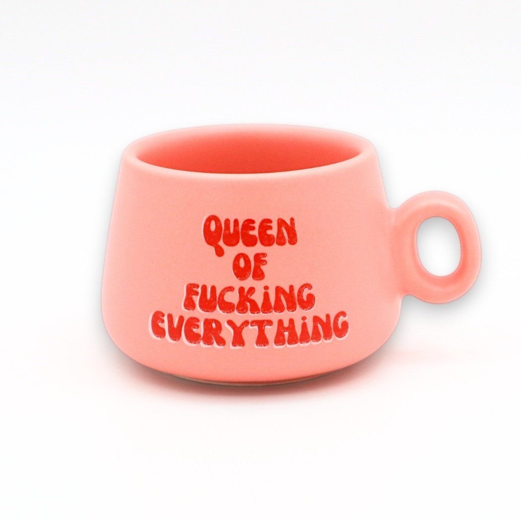 Mellow Monkey pink ceramic shot glass mug with red Queen of Fucking Everything text, 2 oz capacity.