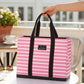 Mellow Monkey Original Deano large tote bag in pink and white stripes with black handles on a patio table