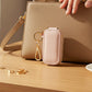 Mellow Monkey pink vegan leather jewelry case with gold swivel snap clip and keyring for travel and on-the-go storage.