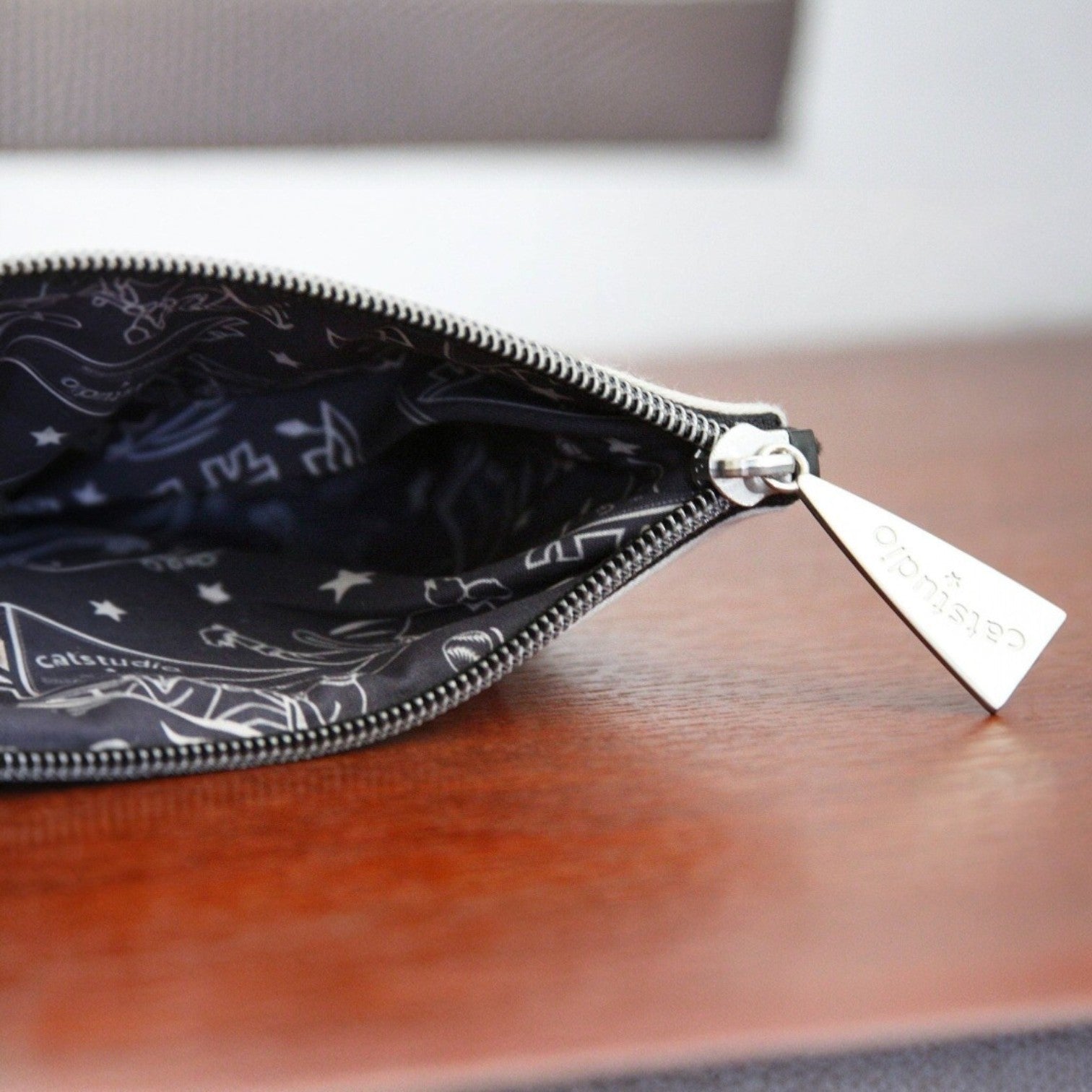 Mellow Monkey University of Pittsburgh woven zip pouch with custom silver star zipper pull and collegiate lining.