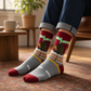 Mellow Monkey Pizza Rat bamboo knit socks featuring a rat with pizza and New York street signs on a red and grey base
