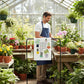 Mellow Monkey 100% cotton tea towel with colorful potted plants and the text "HOME IS WHERE MY PLANTS ARE."