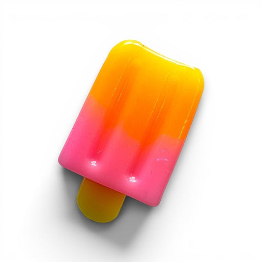 Mellow Monkey 3-inch glittery popsicle squeeze toy in vibrant pink, orange, and yellow gradient for stress relief.