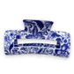 Mellow Monkey hair claw clip featuring a blue and white porcelain-inspired floral pattern on a white background.