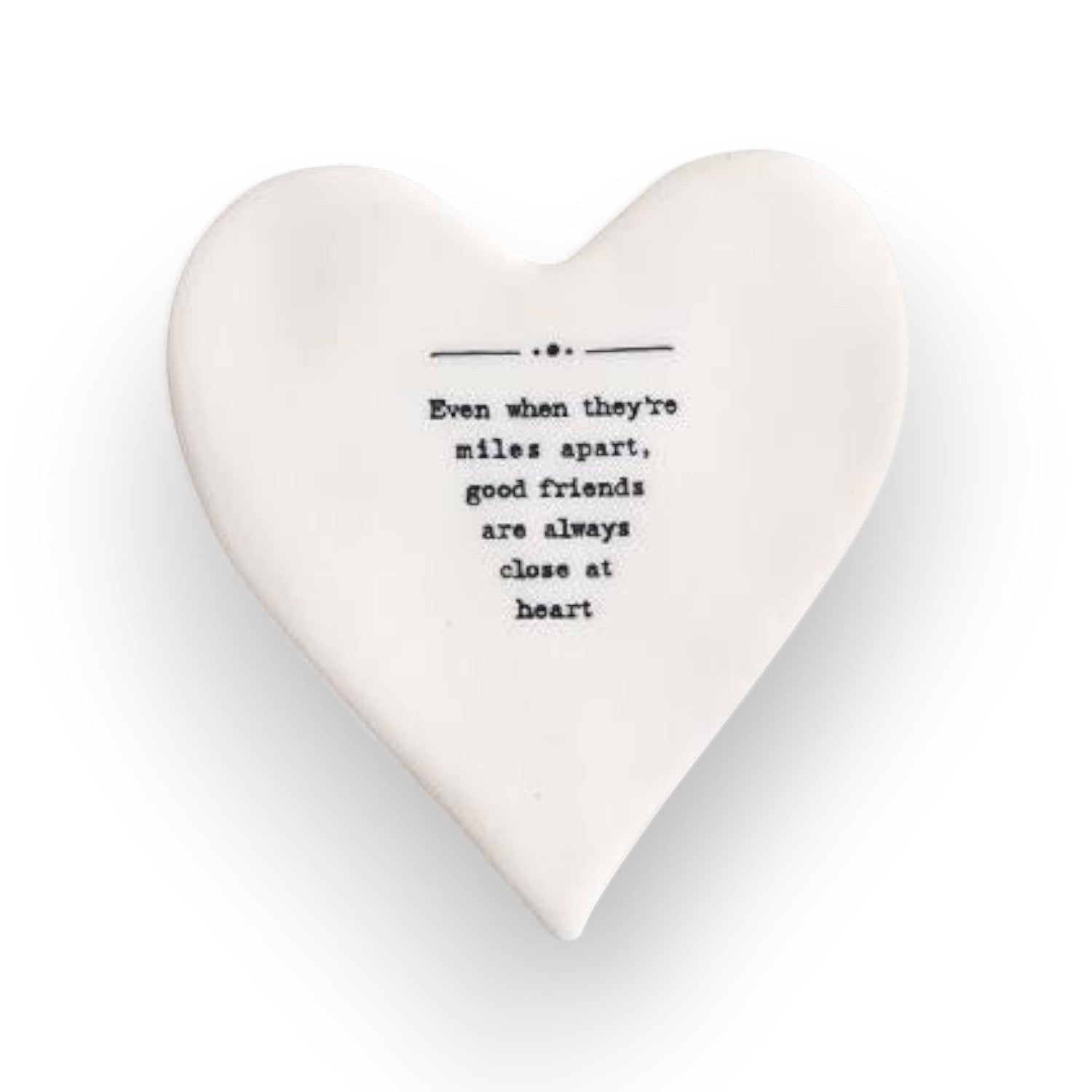 Mellow Monkey white porcelain heart-shaped coaster with black text about friendship and miles apart