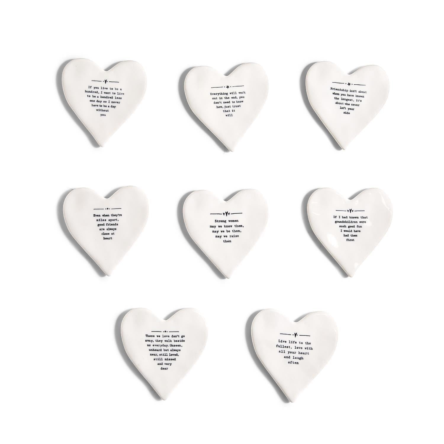 Mellow Monkey white porcelain heart-shaped coasters with black inspirational quotes and illustrations