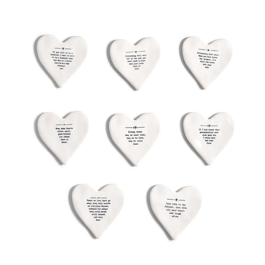 Mellow Monkey white porcelain heart-shaped coasters with black inspirational quotes and illustrations