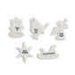 Mellow Monkey porcelain holiday wish tokens featuring sculpted shapes and heartfelt messages in black lettering.