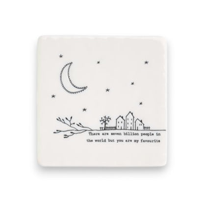 Mellow Monkey white porcelain square coaster featuring a black line art moon, stars, houses, and inspirational quote.