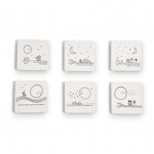 Mellow Monkey set of six white porcelain square coasters featuring black inspirational quotes and whimsical drawings.