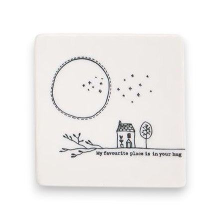 Mellow Monkey square white porcelain coaster featuring a black line drawing of a house and the text My favorite place