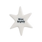 Mellow Monkey porcelain star token with Shine Brightly message in black lettering on a smooth white glazed surface.
