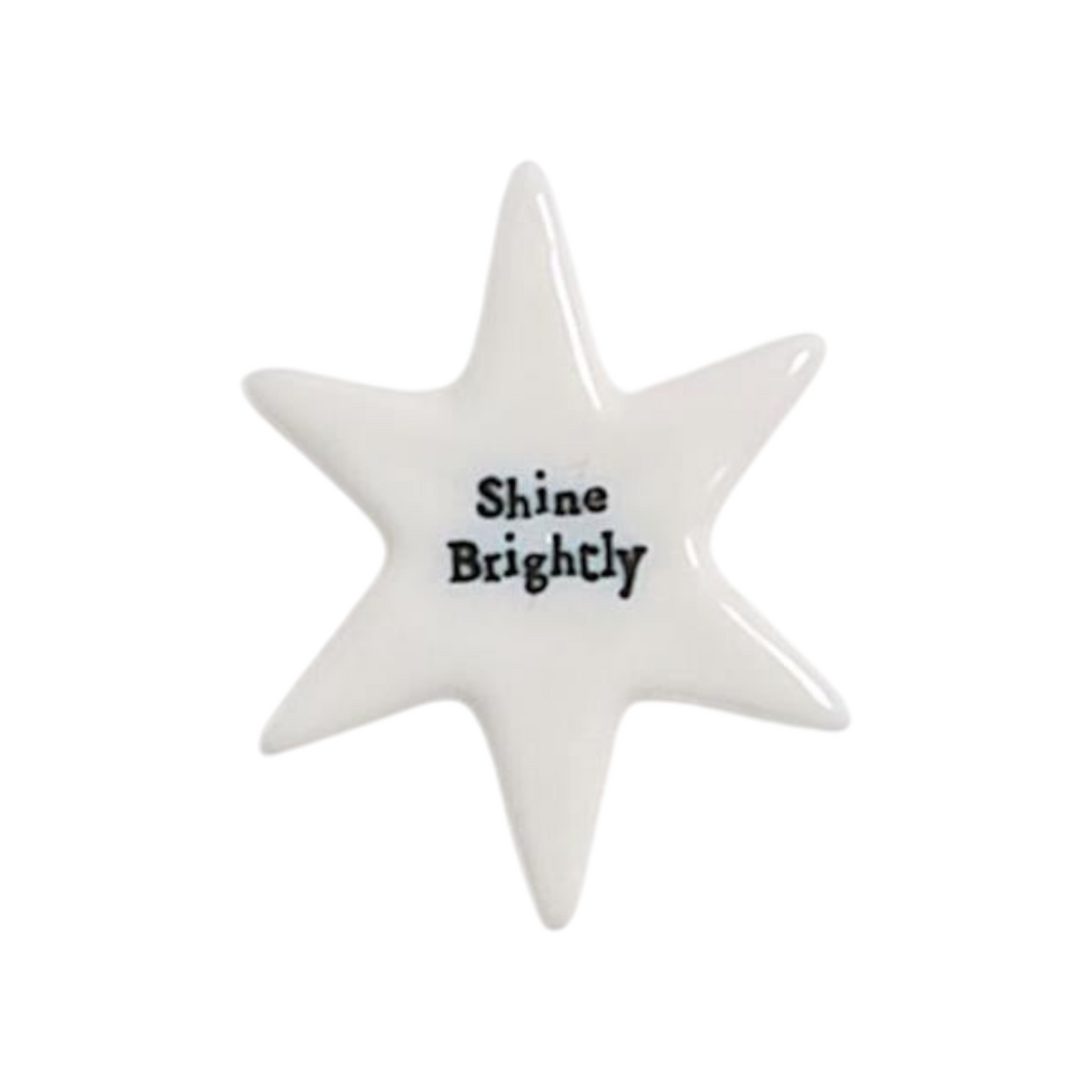 Mellow Monkey porcelain star token with Shine Brightly message in black lettering on a smooth white glazed surface.