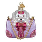Mellow Monkey Posh Pup In Purse blown glass holiday ornament, white dog with pink bow in sparkly purple purse with gold chain.