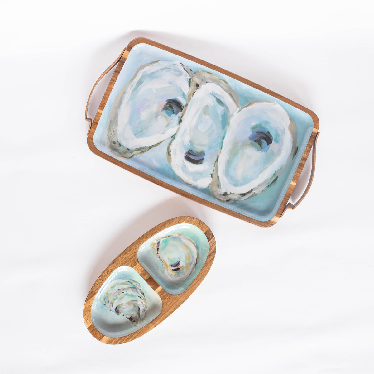 Mellow Monkey Providence oval acacia wood serving tray featuring Kim Hovell oyster shell artwork on a white background