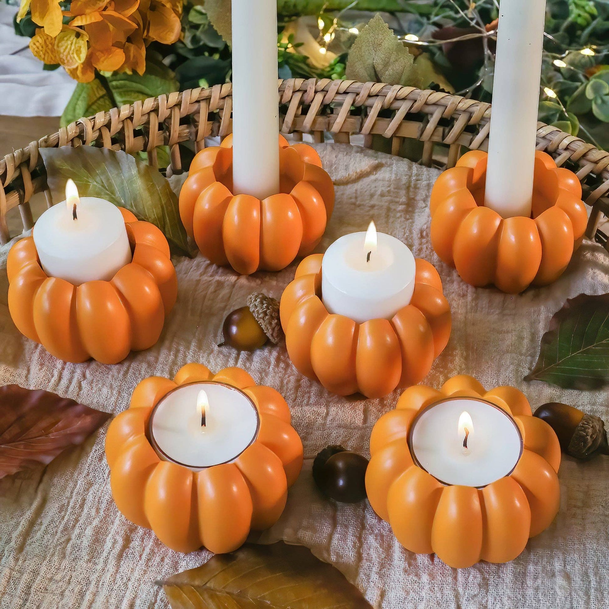 Mellow Monkey set of 6 orange resin pumpkin candle holders styled as both tealight and taper candlestick holders.
