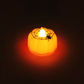 Mellow Monkey mini orange LED pumpkin tealight candle with a black spider and web design for Halloween decor