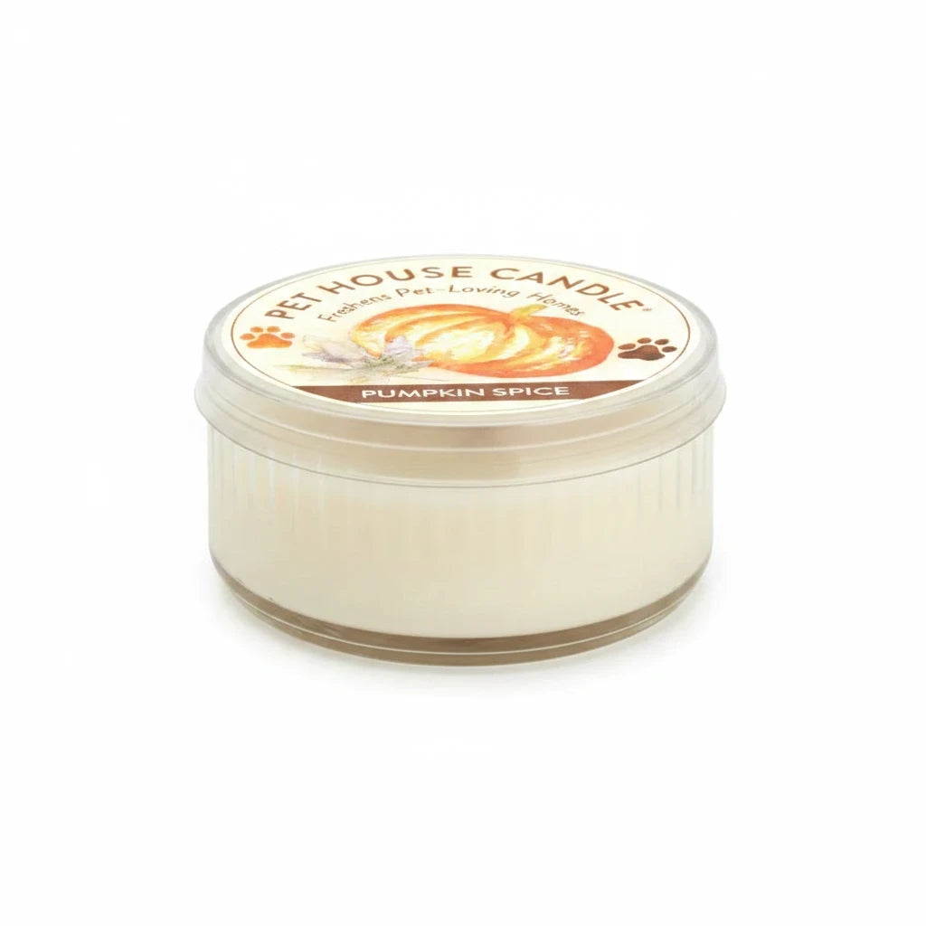 Mellow Monkey Pumpkin Spice Pet House mini candle in a clear glass jar with a decorative label for odor neutralizing.
