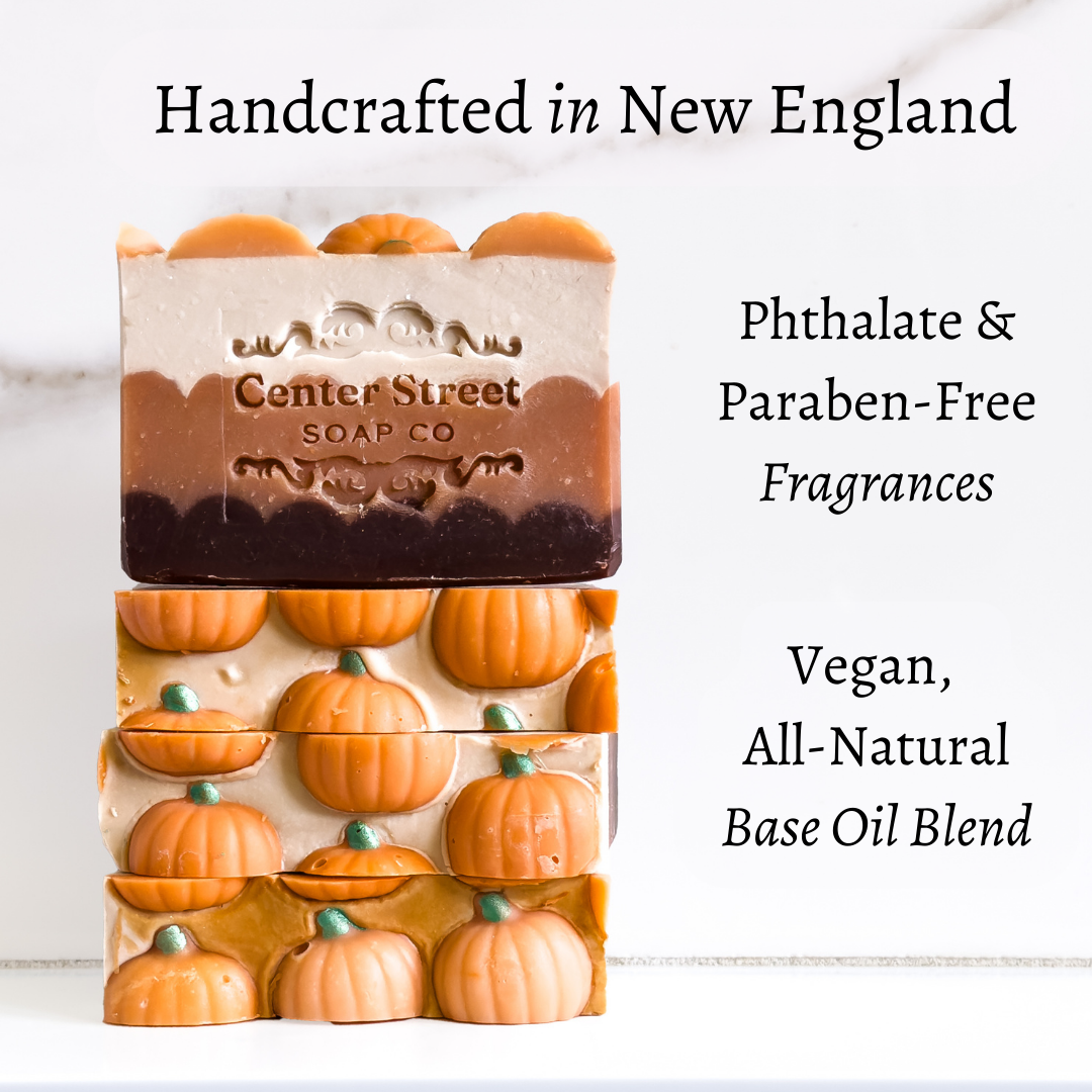 Mellow Monkey Pumpkin Spice vegan artisan bar soap with pumpkin-shaped details in a layered autumn color palette.