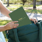 Mellow Monkey Pumpkins & Pastures FlowArt dot-by-letter pad being pulled from a green tote bag in an outdoor setting.