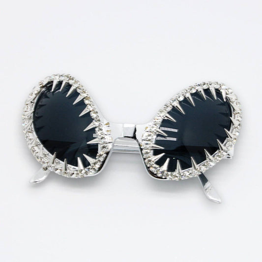 Mellow Monkey black cat-eye sunglasses with silver spiked frames and crystal embellishments for a punk aesthetic.