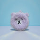 Mellow Monkey Good News Bears scrubby sponge in soft purple with black embroidered face. Dual-sided for versatile cleaning.