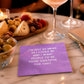 Mellow Monkey purple cocktail napkin with white text reading I'm not as mean as I could be on a marble table