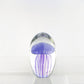 Mellow Monkey purple glass jellyfish paperweight with detailed tentacles inside a clear oval glass dome