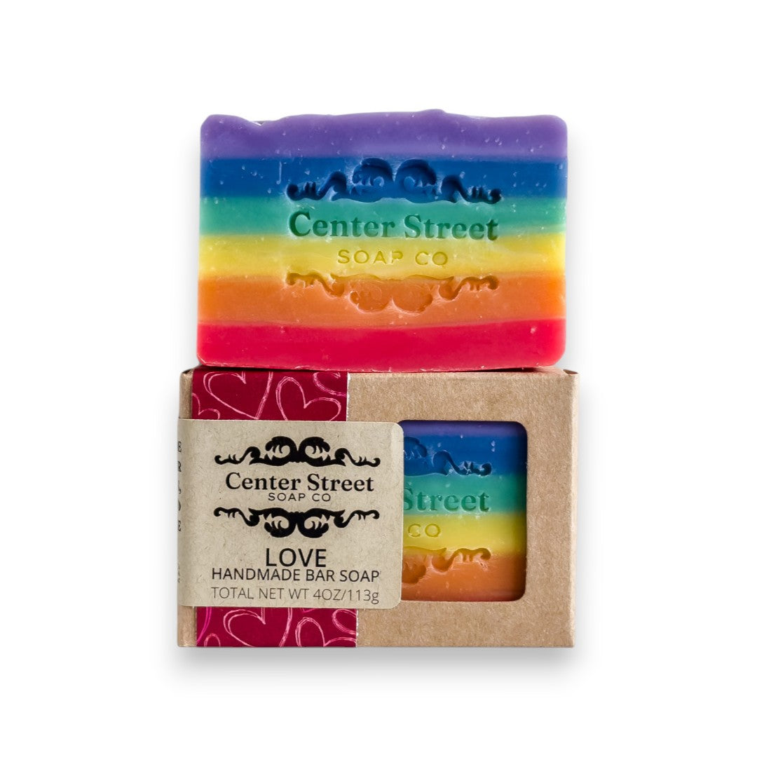 Mellow Monkey Love Rainbow Pride handmade bar soap, 4oz, with rainbow colors and embossed logo.