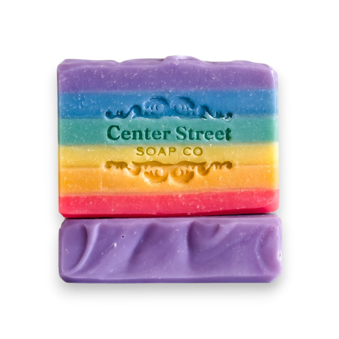 Mellow Monkey Love Rainbow Pride handmade bar soap, 4-oz, with vibrant rainbow stripes and embossed logo.