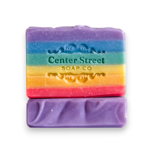 Mellow Monkey Love Rainbow Pride handmade bar soap, 4-oz, with vibrant rainbow stripes and embossed logo.