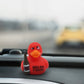 Mellow Monkey red rubber duck holding a beer bottle with Quack Open a Cold One text on a car dashboard