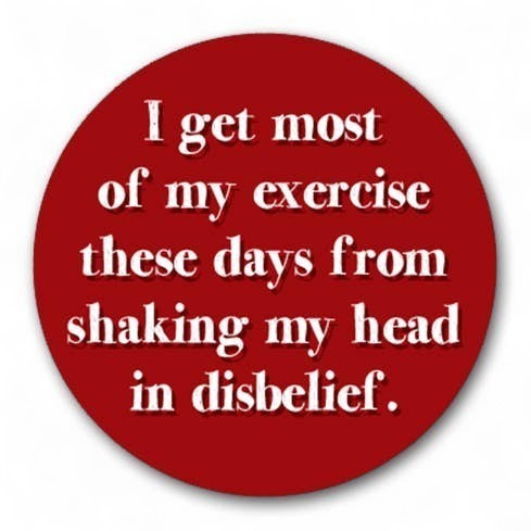 Mellow Monkey 1.25 inch round red pin-back button with white text reading I get most of my exercise shaking my head