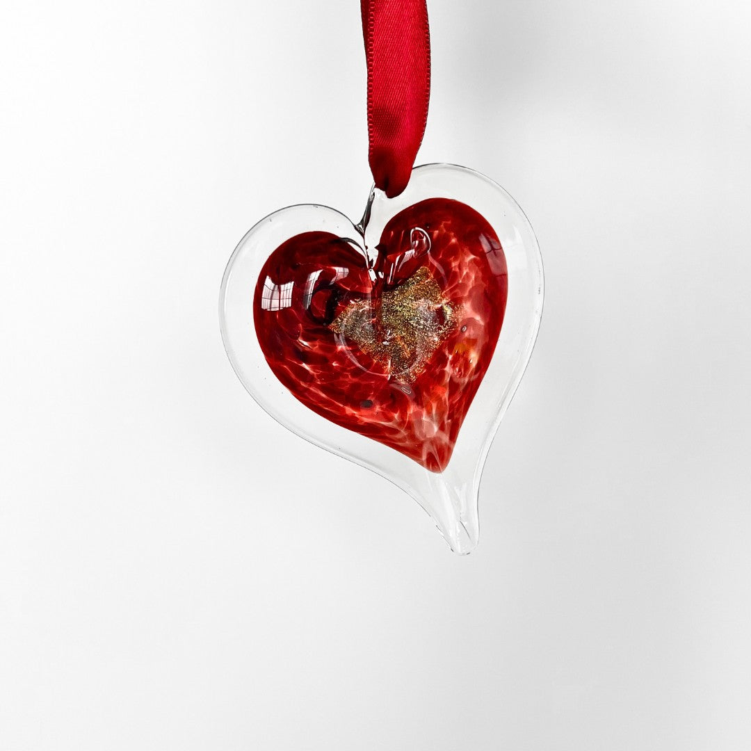 Mellow Monkey 3-inch hand-blown red glass heart ornament with gold accents and a red ribbon for hanging.