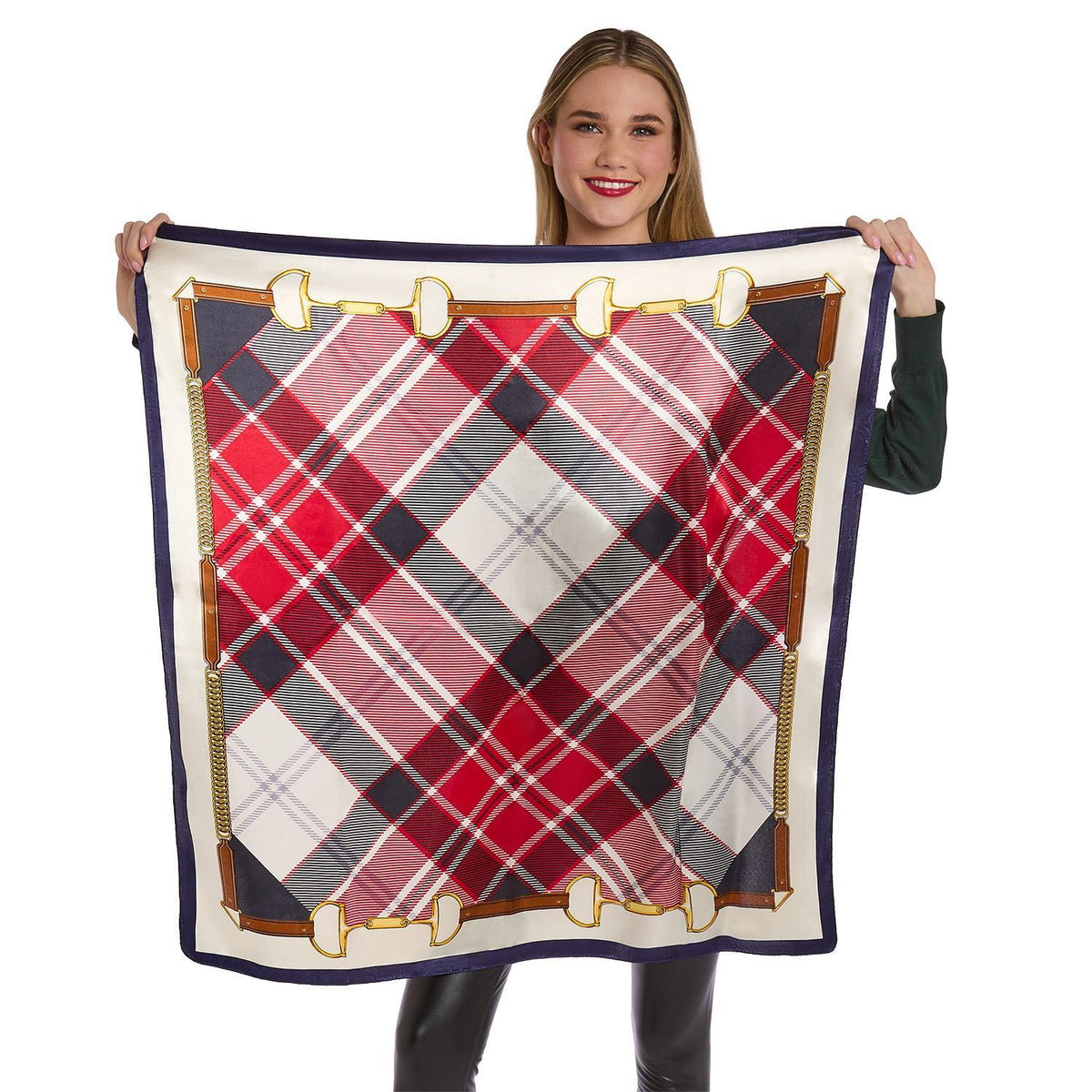 Mellow Monkey red tartan silky scarf with a navy border and gold equestrian buckle print held by a smiling woman