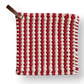 Mellow Monkey 8-inch square crocheted pot holder in red and white stripes with a brown leather hanging loop.