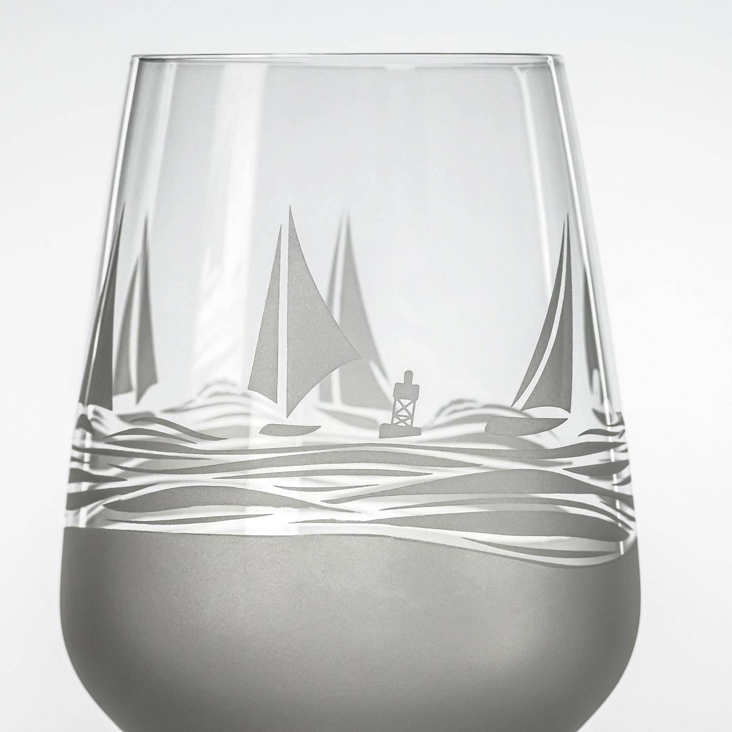 Mellow Monkey Regatta wine glass featuring sand-etched sailboats and waves with a frosted base