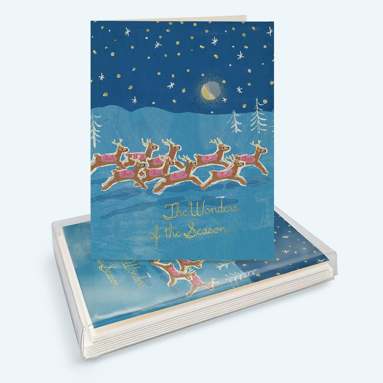 Mellow Monkey boxed holiday cards featuring a whimsical reindeer illustration on a starry blue winter night background.