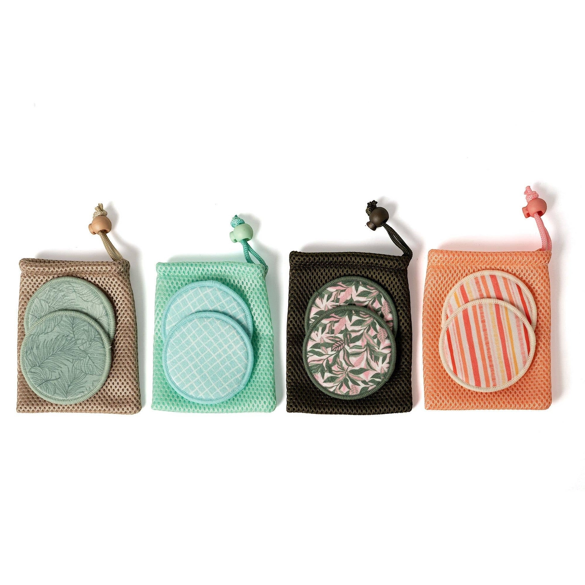 Mellow Monkey reusable makeup remover rounds in patterned fabric with matching mesh laundry pouches for sensitive skin.