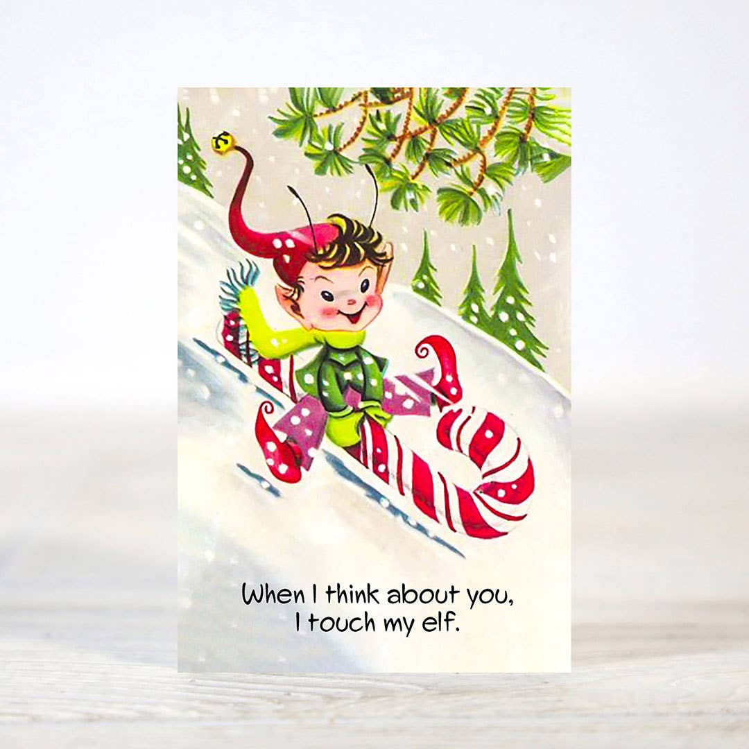 Mellow Monkey mini Christmas card featuring a vintage-style elf illustration on a candy cane sled in the snow
