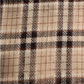 Mellow Monkey Rory classic plaid fringe scarf in soft brushed acrylic with a tan, brown, and cream checkered pattern.