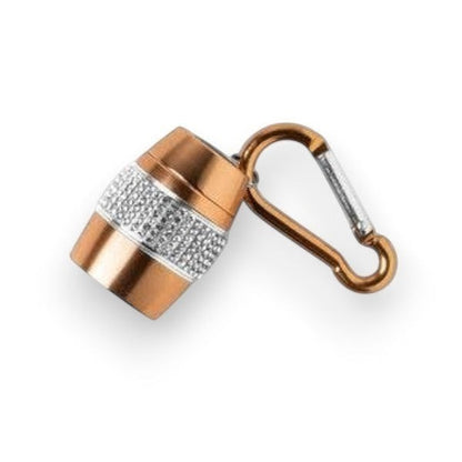 Mellow Monkey rose gold barrel-shaped keychain flashlight with rhinestone band and carabiner clip.