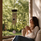 Mellow Monkey rose quartz mini healing wind chime with aluminum tubes hanging on a serene garden patio
