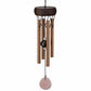 Mellow Monkey mini wind chime with copper-toned tubes, wooden canopy, and a hanging rose quartz healing stone pendant.