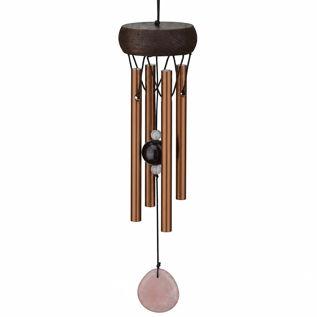 Mellow Monkey mini wind chime with copper-toned tubes, wooden canopy, and a hanging rose quartz healing stone pendant.