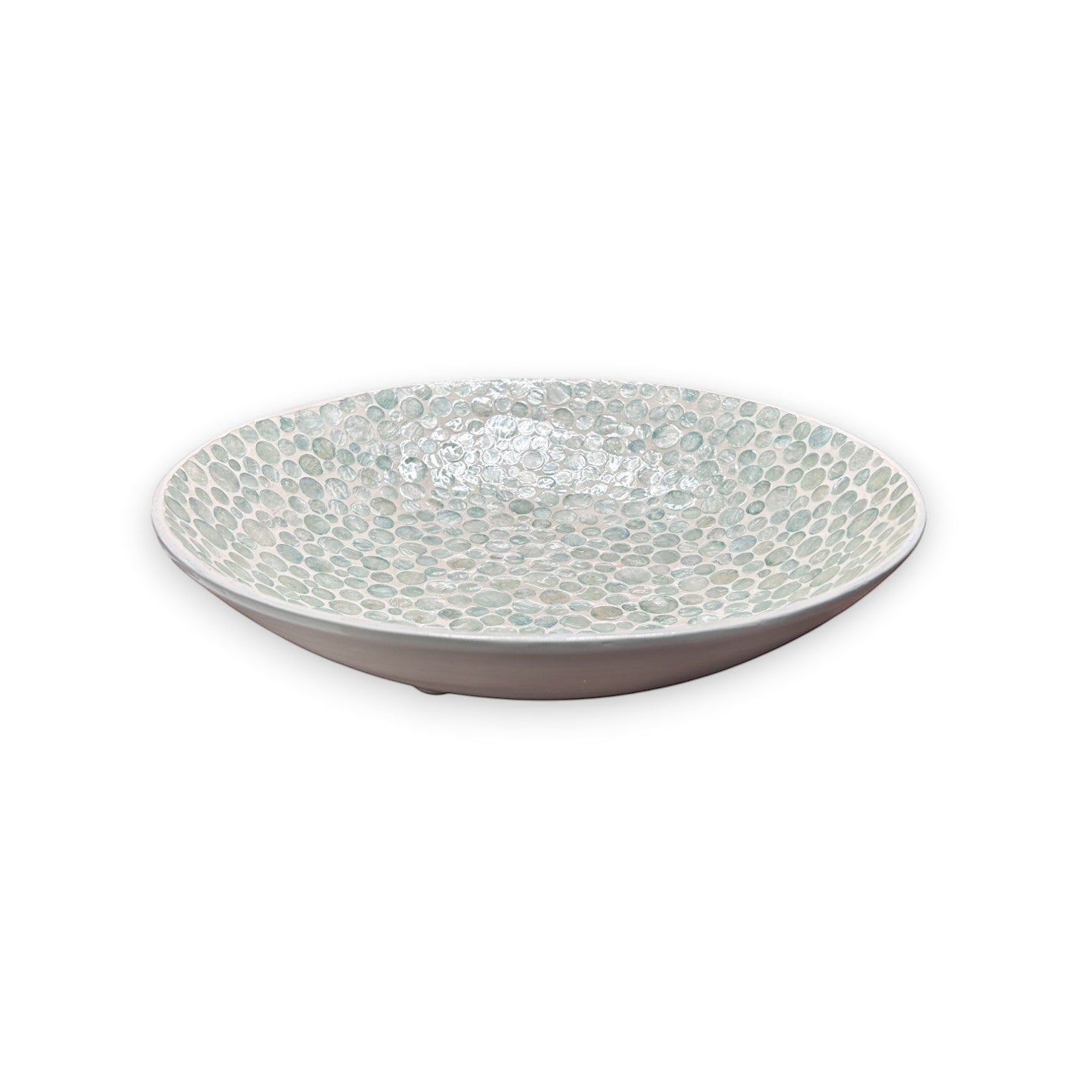 Mellow Monkey 18-inch round bowl crafted from iridescent capiz shells with small ball feet for coastal decor.